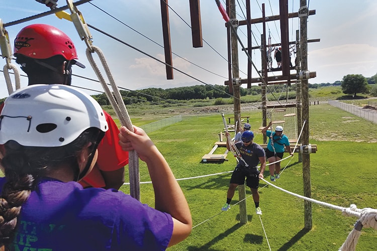 students on a high element at the challenge course