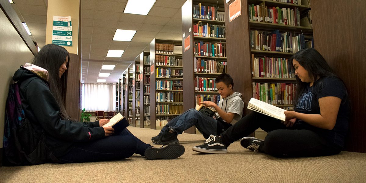 High School Students Studying in the library