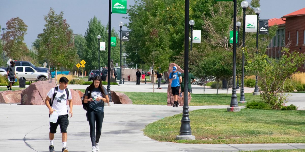 Adams State students walking on campus.