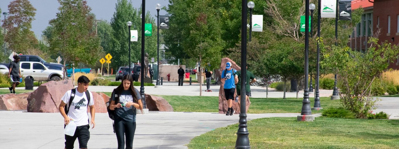 Adams State students walking on campus.