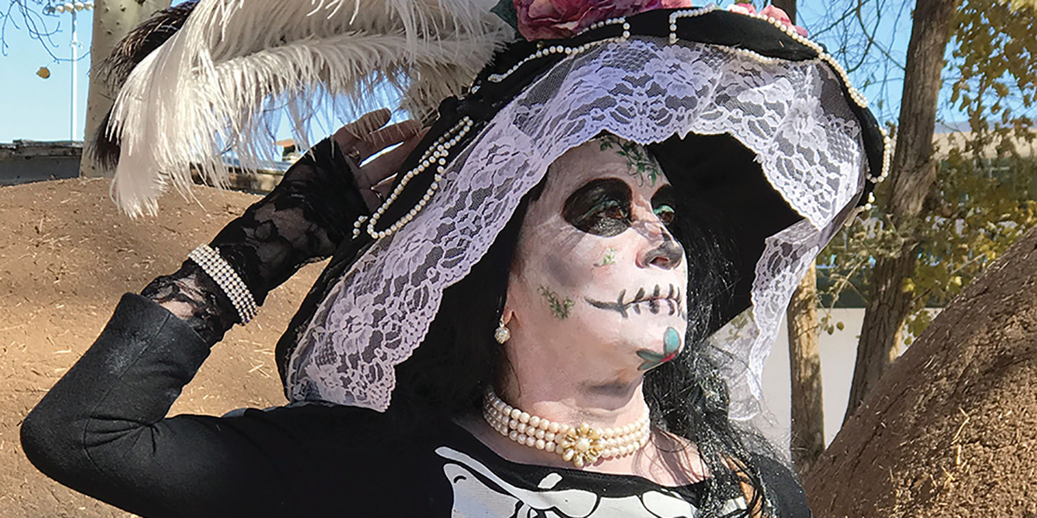 woman in traditional dia de los muertos costume