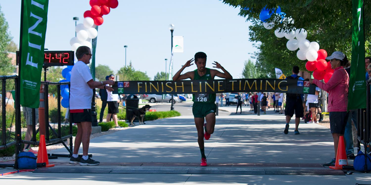 runner crossing finish line