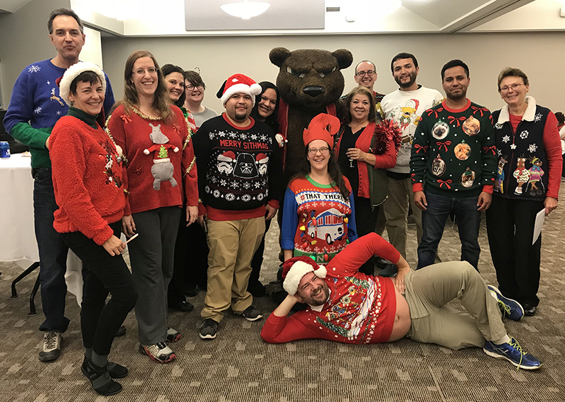 Adams State faculty and staff show off holiday sweaters