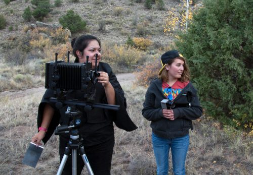 Students with large format camera outdoors