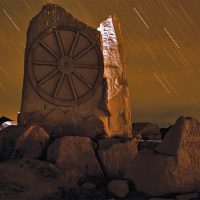 old spanish trail markers with night sky