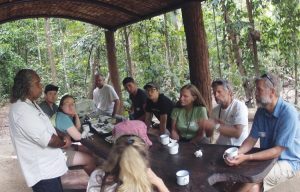 student group sits at picnic table in Costa Rica
