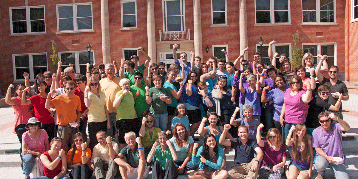 Students and staff in colorful shirts outside Richardson Hall