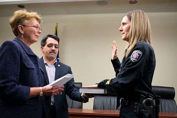 Cheryl Lovell and Vice President for Student Services Ken Marquez swear-in Police Chief Erika Derouin 