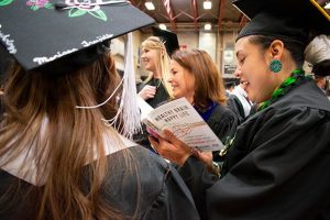 Undergraduates in Field House before Adams State commencement ceremony