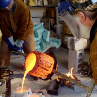 Huberto Maestas and son bronze pour