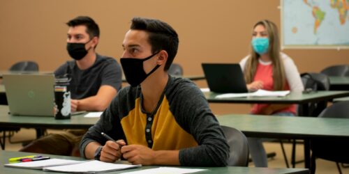 students in classroom wearing masks