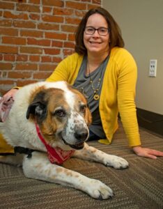 Laura Bruneau and her retired therapy dog Moose