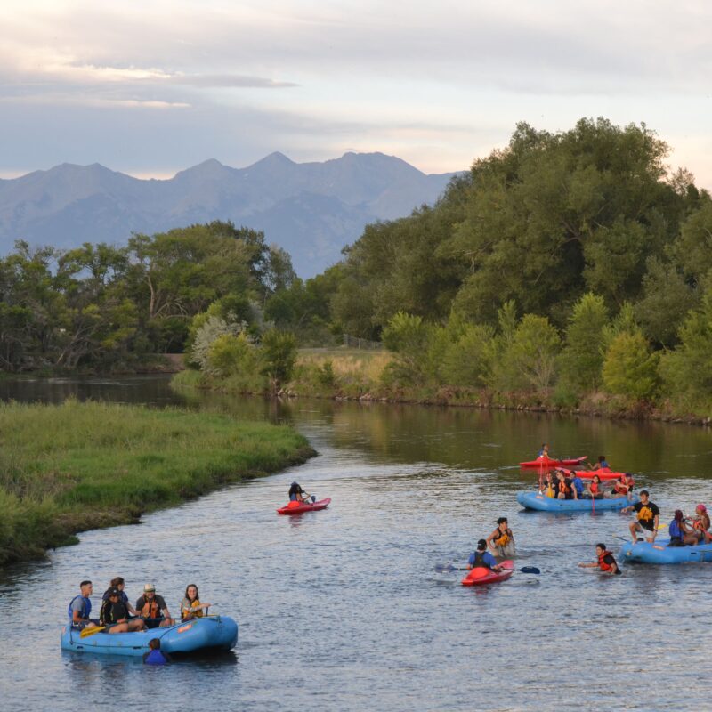 students rafting and paddling on the rio grande