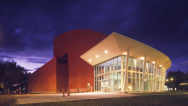 Adams State Theatre building at twilight
