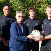 Adams State President receives signed men's soccer ball