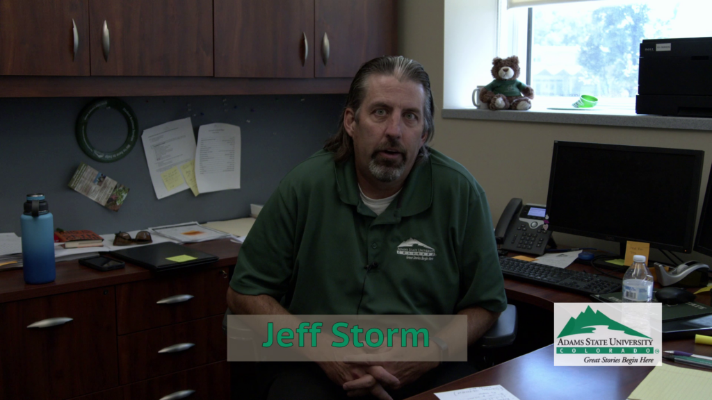 Jeff Storm, Transfer Student Coordinator, Adams State sits in his office and talks to the camera. 
