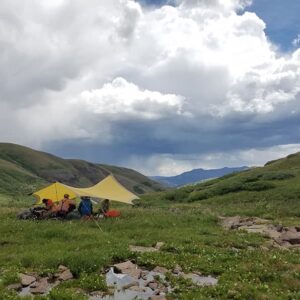 people under tarp in mountains