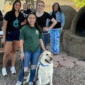 group of people with dog near horno