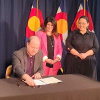 Matthew Martinez, Jared Polis, Rose Publiese, Julie Gonzales at HB 23-1037 signing
