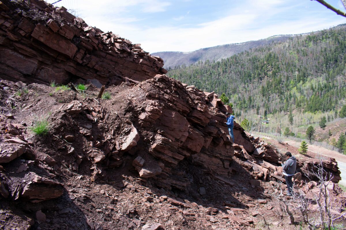 Students and professor work on a rock face on La Veta Pass.