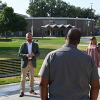 President Tandberg speaking to visitors on the Adams State campus