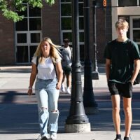Adams State University students crossing first street in Alamosa