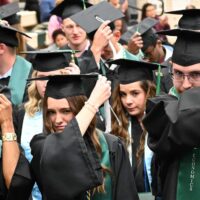 Adams State University 2025 Fall Commencement Graduates switch tassels from right to left