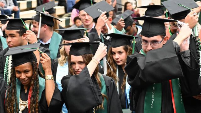 Adams State University 2025 Fall Commencement Graduates switch tassels from right to left