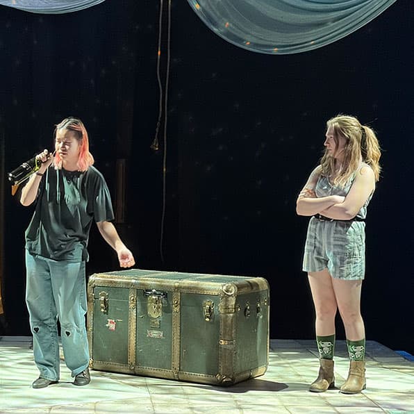 Adams State University Theatre Production Merely Players two actors on stage rehearsing