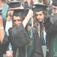 Adams State University 2025 Fall Commencement Ceremony graduates switching tassels