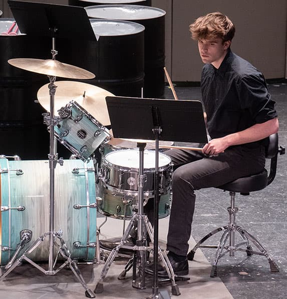 Collin Wankelman at Adams State University 2025 Spring Percussion Concert playing drum set