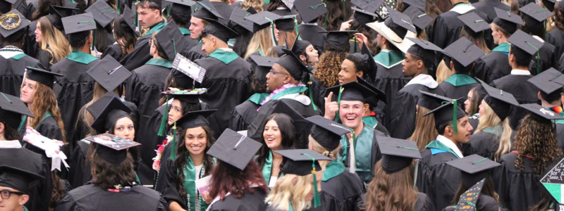 Adams State University Spring 2026 Undergraduate Commencement Ceremony Graduates in rows looking up