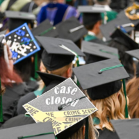 Adams State University 2026 Spring Commencement Ceremony rows of graduates caps