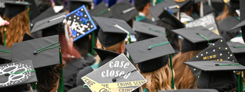 Adams State University 2026 Spring Commencement Ceremony rows of graduates caps