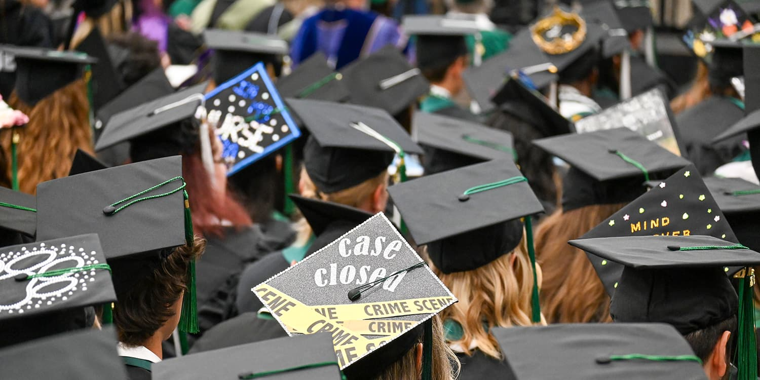 Adams State University 2026 Spring Commencement Ceremony rows of graduates caps