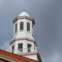 Adams State University Richardson Hall cupola with stormy clouds