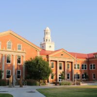 Adams State University Richardson Hall with campus green