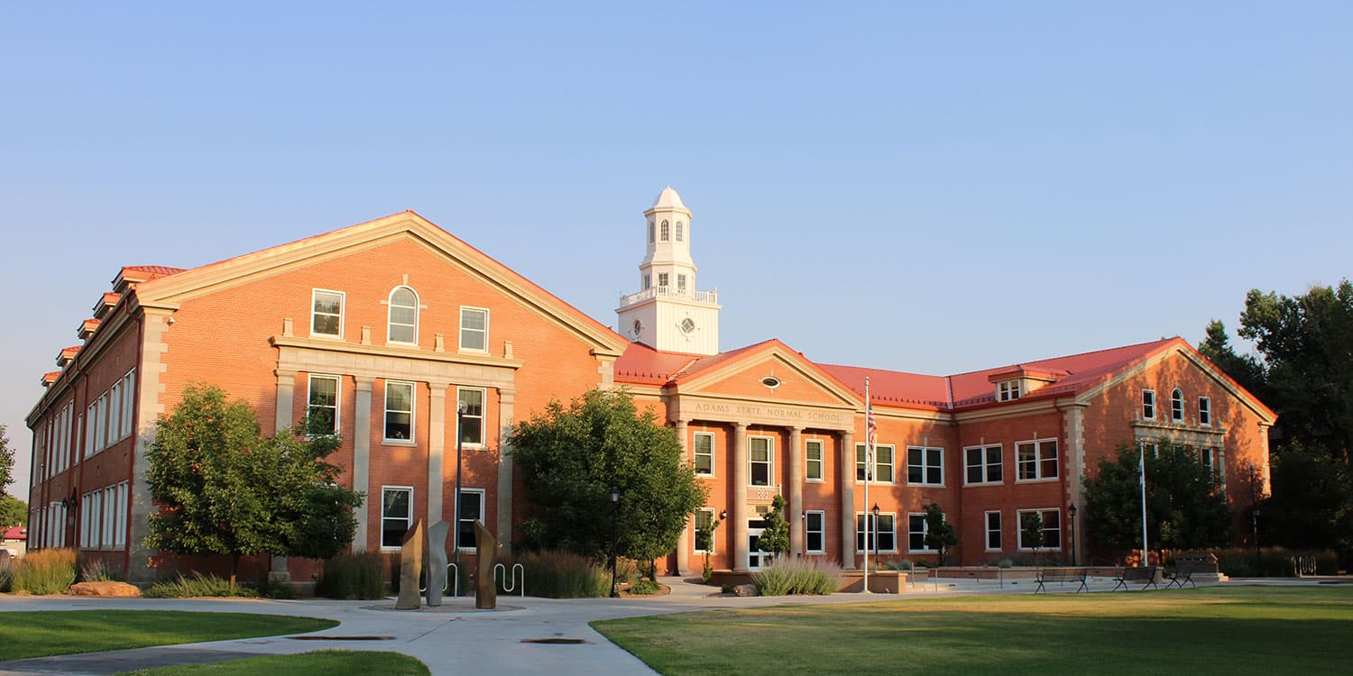 Adams State University Richardson Hall with campus green