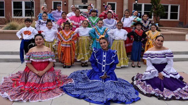 Adams State University Semillas de la Tierra dancers in front of Richardson Hall