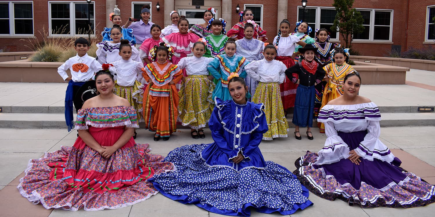 Adams State University Semillas de la Tierra dancers in front of Richardson Hall